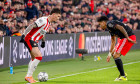 Dennis Man of PSV Eindhoven dribbles with the ball under pressure from Luis Diaz of FC Bayern Munchen during the UEFA Champions League 2025/26 League Phase MD8 match between PSV Eindhoven and FC Bayern Munchen at PSV Stadion on January 28, 2026 in Eindhov