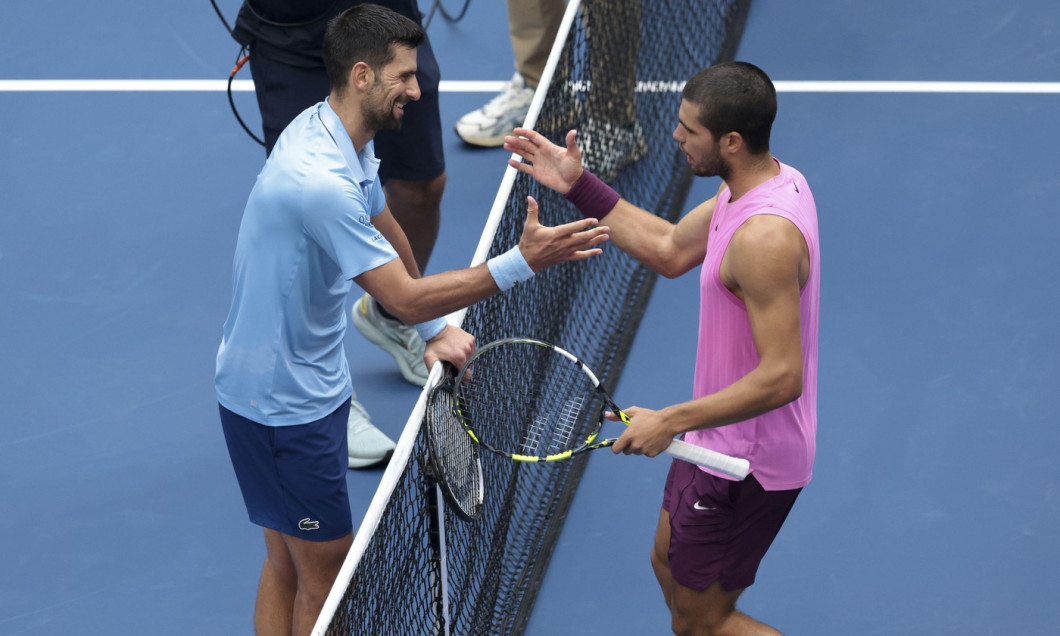 Carlos Alcaraz of Spain (R) greets at the net Novak Djokovic of Serbia after his semifinal victory on day 13 of the 2025 US Open Tennis Championships, Grand Slam tennis tournament on September 5, 2025 at USTA Billie Jean King National Tennis Center in Flu