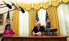 United States President Donald J. Trump signs the document granting Alice Marie Johnson, criminal justice reform advocate, a full pardon in the Oval Office of the White House in Washington, DC. Ms. Johnson looks on from left.Credit: Anna Moneymaker / Pool