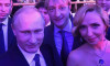 Former ice skater Tatiana Navka pictured with Vladimir Putin at a reception in Kremlin in December 2014. Putin's spokesperson Dmitry Peskov and Tatiana Navka had a child by then but were not officially married yet.