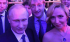 Former ice skater Tatiana Navka pictured with Vladimir Putin at a reception in Kremlin in December 2014. Putin's spokesperson Dmitry Peskov and Tatiana Navka had a child by then but were not officially married yet.