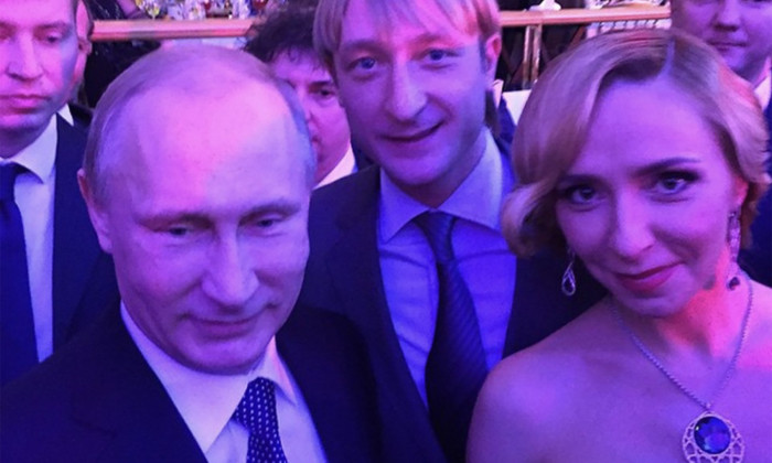Former ice skater Tatiana Navka pictured with Vladimir Putin at a reception in Kremlin in December 2014. Putin's spokesperson Dmitry Peskov and Tatiana Navka had a child by then but were not officially married yet.