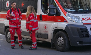 Croce Rossa Italiana (Italian Red Cross) first aid workers standing by their ambulance during an organized event in Catania, Sicily.
