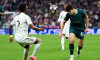 Madrid, Spain. 11th Mar, 2026. Abdukodir Khusanov of Manchester City FC battles for the ball with Vinicius Junior of Real Madrid CF during the UEFA Champions League match between Real Madrid CF and Manchester City at Bernabeu Stadium on March 11, 2026. -