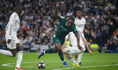 Madrid, Spain, March 11, 2026: Manchester City's Jérémy Doku (11, 2L) dribbles past Dean Huijsen (24, 2R) during the first leg of the 2025-26 UEFA Champions League Round of 16 between Real Madrid and Manchester City, on March 11, 2026, at the Santiago Ber
