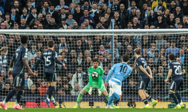 Manchester, UK. 17th Mar, 2026. Real Madrid goalkeeper Thibaut Courtois saves a shot on goal from Rayan Cherki of Manchester City during the UEFA Champions League last 16 second leg match Manchester City vs Real Madrid at The City of Manchester Stadium, M