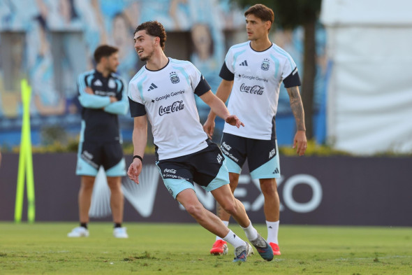Argentina's forward Joaquin Panichelli (L) and defender Lucas Martinez Quarta look on during a training session in Ezeiza, Buenos Aires Province, on March 25, 2026, ahead of the FIFA World Cup 2026 friendlys football matches against Mauritania and Zambia.