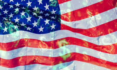 Germany - September 17, 2025: PHOTOMONTAGE, The US flag with dollar symbols superimposed on it directly links the nation