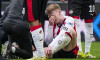 EINDHOVEN - Jerdy Schouten of PSV Eindhoven lies on the ground with an injury during the Dutch Eredivisie match between PSV and FC Utrecht at the Philips Stadium on April 4, 2026, in Eindhoven, the Netherlands. TOBIAS KLEUVER / ANP