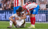 Madrid, Spain. 10th Apr, 2026. Kylian Mbappe (L) of Real Madrid CF lies injured on the pitch with Alex Moreno (R) of Girona FC during the LaLiga EA Sports 2025/2026 week 31 football match between Real Madrid CF and Girona FC at Santiago Bernabeu stadium.