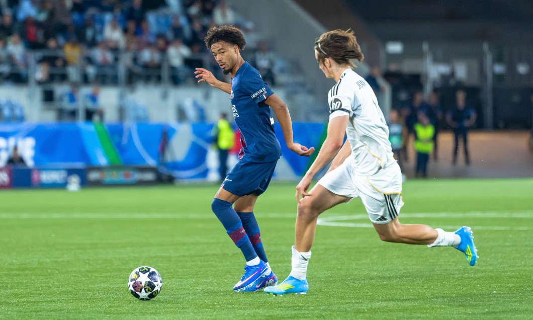 Lausanne, Switzerland - 17 April 2026: Mathis Jangeal (Paris Saint-Germain) looking where his pass goes, in front of Joan Martinez (Real Madrid) during the UEFA Youth League semi-final game between Real Madrid and Paris Saint-Germain at Stade de la Tuilie