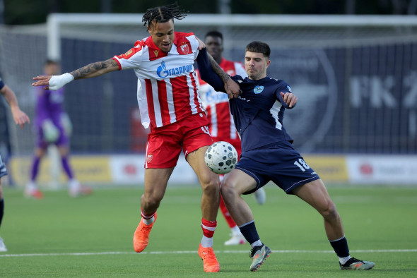Pancevo, Serbia. 22nd April, 2026. Crvena Zvezda's Jay Ifeanyi-Junior Enem and Zeleznicar's Stefan Pirgic (R) during Serbian Superleague football match between Zeleznicar and Crvena Zvezda (Red Star) on April 22. 2026. in Pancevo, Serbia. (photo by Pedja