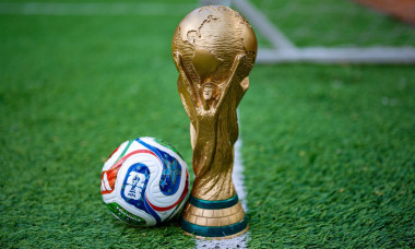 May 7, 2026, United States. The trophy of the 2026 FIFA World Cup and the official Adidas Trionda ball on the green lawn of the stadium.
