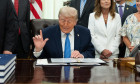 President Donald Trump signs the "Secure America Act" in the Oval Office