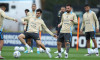 Argentina s defender Leonardo Balerdi (C) next forward Lionel Messi during a training session in Ezeiza, Buenos Aires Pr