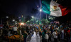 Mexican fans celebrate Mexico's victory against South Africa after the World Cup opener