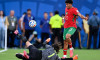 Achraf Hakimi of Morocco (R) and Alisson Becker of Brazil (L) fight for possession during a FIFA Men's World Cup 2026 Group Stage football match between Brazil and Morocco at New York New Jersey Stadium, in