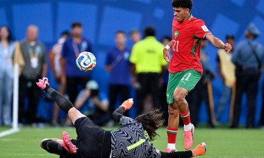 Achraf Hakimi of Morocco (R) and Alisson Becker of Brazil (L) fight for possession during a FIFA Men's World Cup 2026 Group Stage football match between Brazil and Morocco at New York New Jersey Stadium, in
