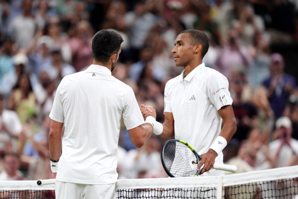 Novak Djokovic of Serbia (left) greets Felix Auger-Aliassime of Canada following their Gentlemen's Singles match on day nine of the 2026 Wimbledon Championships at the All England Lawn Tennis and Croquet Club, London. Picture date: Tuesday July 7, 2026.