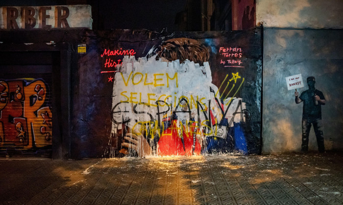 July 22, 2026, Barcelona, Spain: The mural by street artist TVBoy depicting Spain's Ferran Torres kissing the FIFA World Cup trophy is seen vandalized with white paint and graffiti in Barcelona, a day after it appeared following Spain's victory at the 202