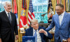 Washington, United States. 23rd July, 2026. U.S. President Donald Trump, shows off a Los Angeles Dodgers championship ring with team owner Mark Walter, left, and manager Dave Roberts, center, during a celebration of their 2025 MLB World Series championshi
