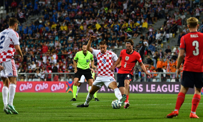 Rijelka, Croatia. 03rd Oct, 2026. RIJEKA, CROATIA - OCTOBER 03: Mario Pasalic of Croatia (CL) in action against Alex Scott of England (CR) during the UEFA Nations League, League A Group A3, match between Croatia and England at Stadion Rujevica, Rijeka on