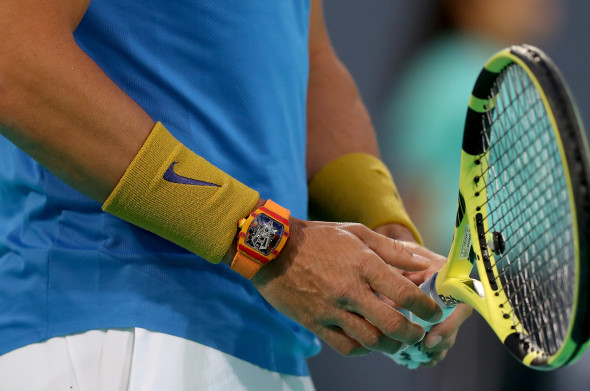 Rafael Nadal, cu ceasul la mână în timpul meciului / Foto: Getty Images