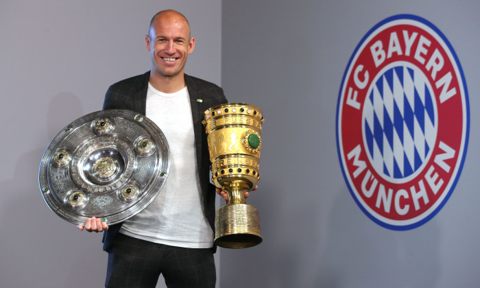 Arjen Robben And Franck Ribery Hand Over Championship And DFB Cup Trophy To FCB Erlebniswelt