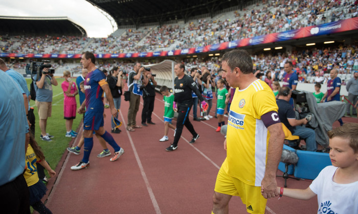 CLUJ, ROMANIA - JUNE 16, 2018: Football player Gheorghe Hagi (Romania Golden Team) and Barcelona Legends entering the playfield at the beginning of a