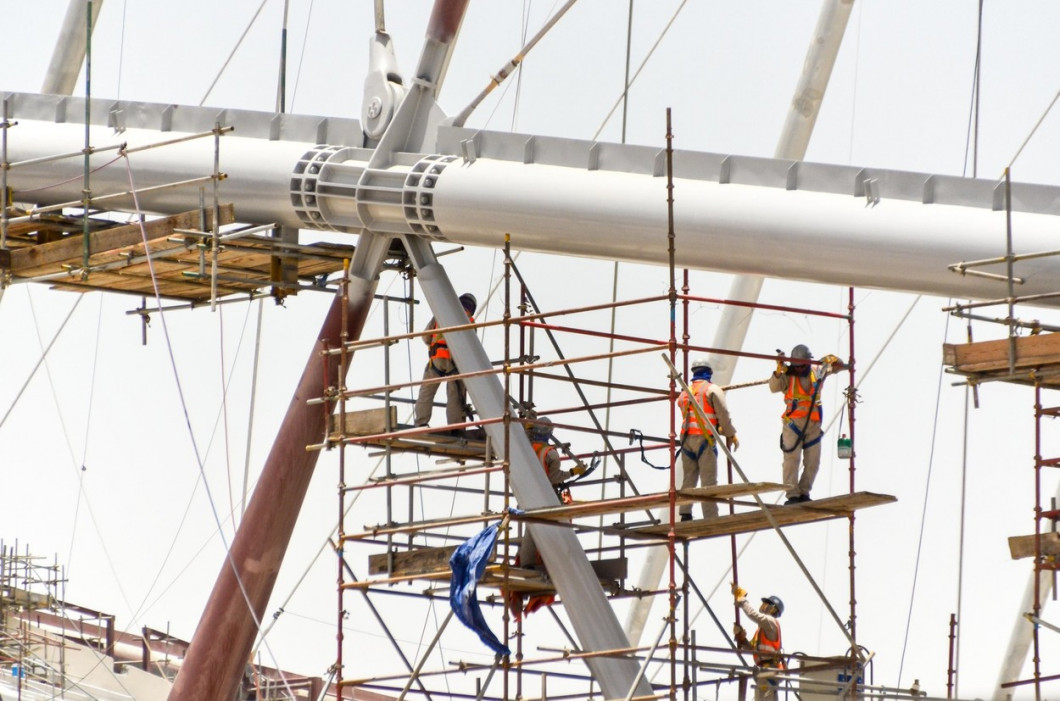 Workers in the structure during the renovation (roof and cooling) of the Khalifa International Stadium in Doha, Qatar