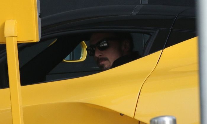 Milan AC soccer player Zlatan Ibrahimovic drives his limited production hybrid sport car Ferrari