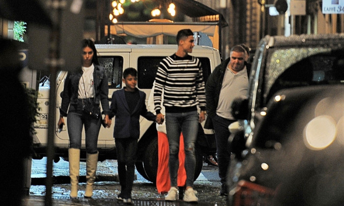 *EXCLUSIVE* Cristiano Ronaldo and his family surrounded by his security entourage leaving a restaurant in Turin