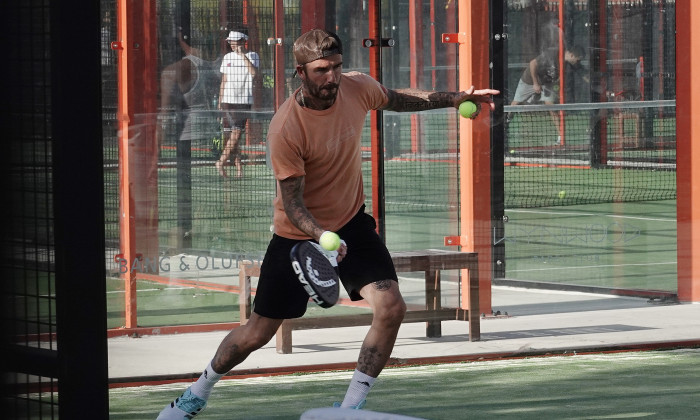 EXCLUSIVE: David Beckham looks intensely focused as he tries out a new sport, paddle ball, with friends in Miami