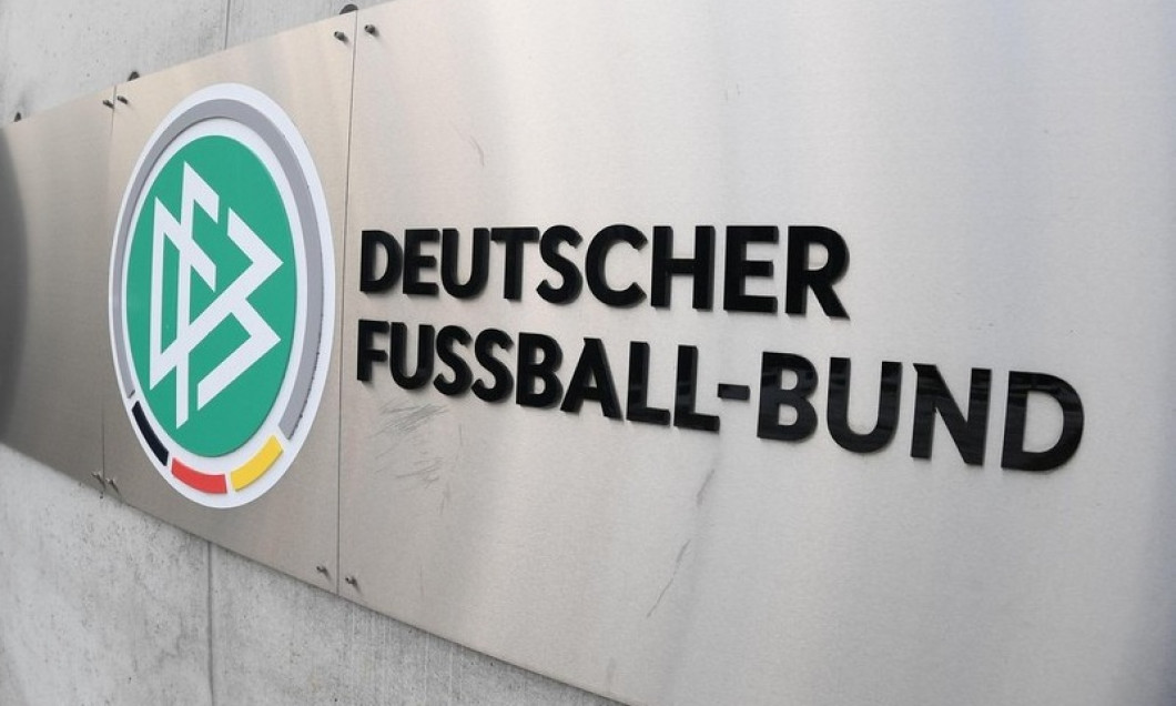 15 January 2021, Hessen, Frankfurt/Main: The logo "DFB" and the lettering "Deutscher Fuball-Bund" are emblazoned on a wall in front of the main entrance to the DFB headquarters. In the inner circle of the crisis-ridden association, the power struggle betw