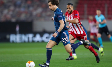 PIRAEUS, GREECE - MARCH 12: David Luiz of Arsenal FC and Youssef El Arabi of Olympiacos FC during the Olympiacos v Arsenal - UEFA Europa League Round