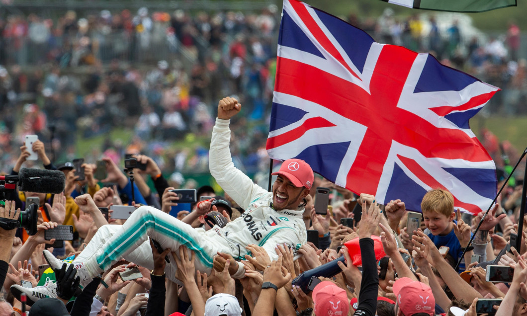 Silverstone, UK. 14th July 2019. FIA F1 Grand Prix of Britain, Race Day; Mercedes AMG Petronas Motorsport driver Lewis Hamilton celebrates his win with the fans Credit: Action Plus Sports Images/Alamy Live News