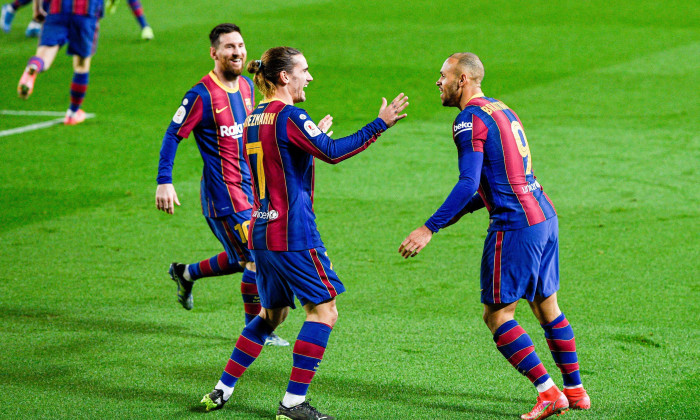 BARCELONA, SPAIN - MARCH 3: Martin Braithwaite of FC Barcelona celebrates his goal with Lionel Messi of FC Barcelona and Antoine Griezmann of FC Barcelona during the Copa del Rey match between Barcelona and Sevilla at Camp Nou on March 3, 2021 in Barcelon