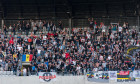 CLUJ NAPOCA, ROMANIA - JULY 12, 2019: Crowd of soccer supporters of U Cluj supporting their favorite football team in the tribune during a match again