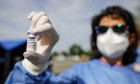 Bucharest, Romania - May 21, 2021: Details with the hand of a medical worker holding a dose of the Pfizer BioNTech Comirnaty anti Covid 19 vaccine at