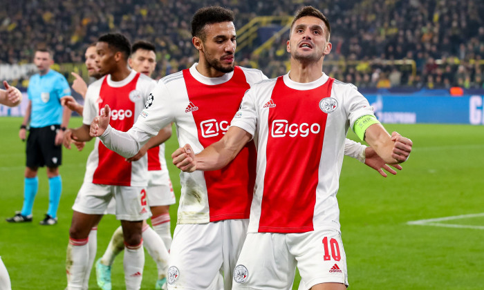 DORTMUND, NETHERLANDS - NOVEMBER 3: Dusan Tadic of Ajax is celebrating his goal, with Noussair Mazraoui of Ajax during the UEFA Champions League Group stage match between Borussia Dortmund and Ajax at Signal Iduna Park on November 3, 2021 in Dortmund, Ne