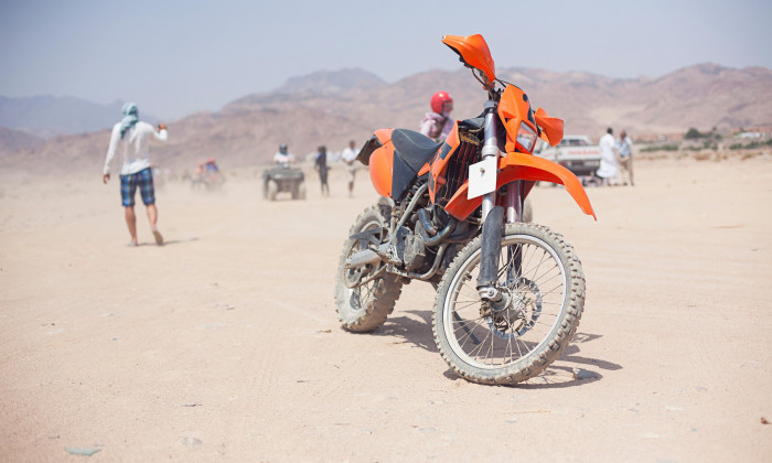 Trip safari with motorcycle in desert