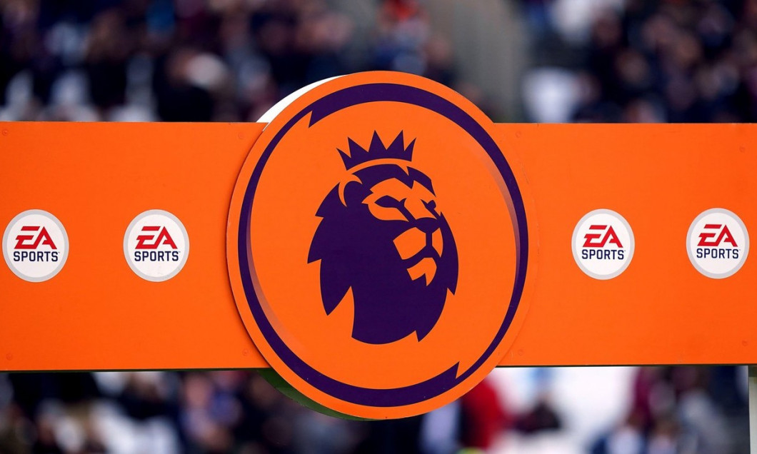 A board with the Premier League logo and EA Sports sponsor is erected on the pitch before the Premier League match at the London Stadium, London. Picture date: Sunday January 16, 2022.
