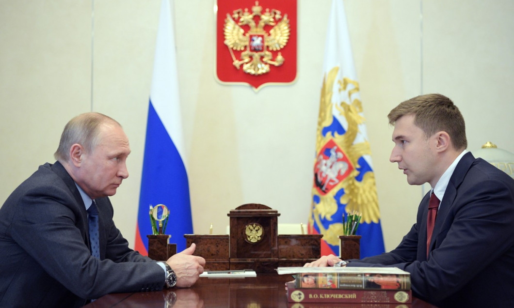 Russia's President Vladimir Putin meets with chess grandmaster Sergey Karjakin