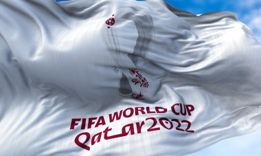 Flag with the 2022 Fifa World Cup logo flapping in the wind