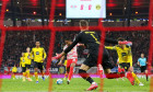 Leipzig, Germany. 06th Nov, 2021. Football: Bundesliga, Matchday 11, RB Leipzig - Borussia Dortmund at Red Bull Arena. Leipzig's Christopher Nkunku (centre) shoots at Dortmund's goal. In goal Dortmund's goalkeeper Gregor Kobel. IMPORTANT NOTE: In accordan