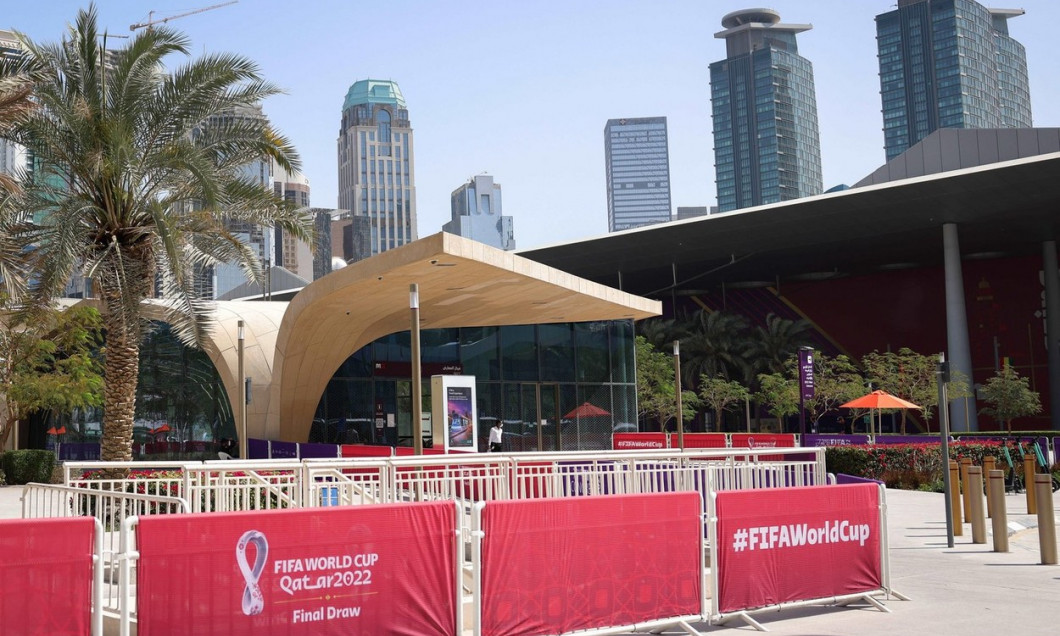 Doha, Qatar. 01st Apr, 2022. Soccer: World Cup, draw for the preliminary round in Doha: Advertising banners with the logo for the Fifa World Cup stand in front of the Doha Exhibition &amp; Convention Center (DECC) in the West Bay district. The draw for the 20