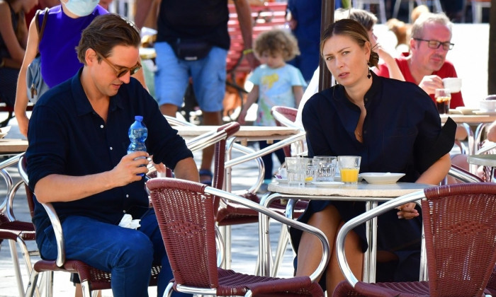 *EXCLUSIVE* Russian tennis player Maria Sharapova and her boyfriend Alexander Gilkes share a crossiant before enjoying some sightseeing in Venice