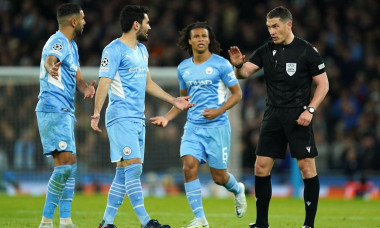 Referee Istvan Kovacs speaks to the Manchester City players during the UEFA Champions League Quarter Final first leg match at the Etihad Stadium, Manchester. Picture date: Tuesday April 5, 2022.