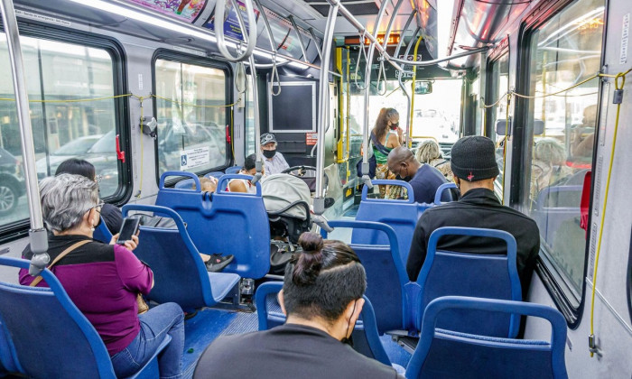 Miami Beach Florida,Miami-Dade Metrobus bus public transportation mass transit,onboard inside interior passengers riders,man male woman female men wom