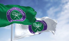 London, UK, April 2022: flags with the The Championships Wimbledon logo waving in the wind. Wimbledon Championships is a major tennis tournament sched